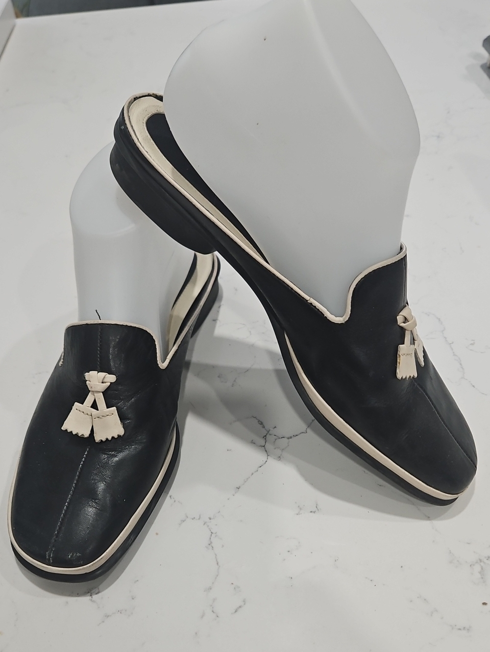 Women's Black Leather Tassel Mukes with Cream Trim